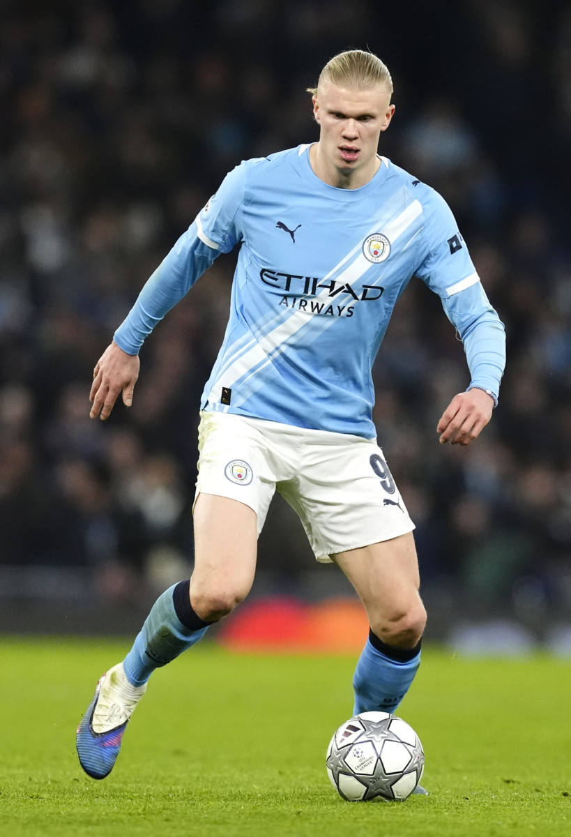 Erling Haaland dribbles with the ball