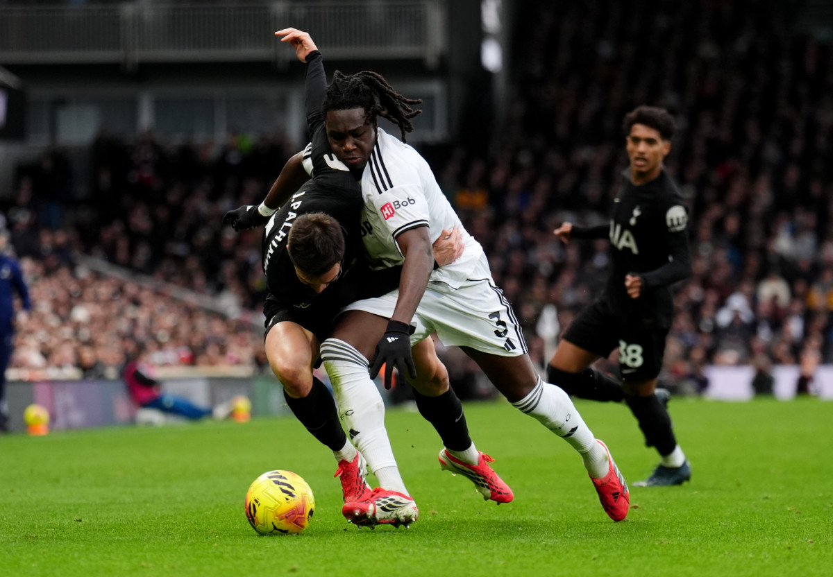 Tottenham’s Joao Palhinha, left, and Fulham’s Calvin Bassey battle for the ball