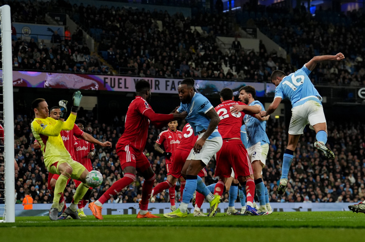 Manchester City’s Rodri (right) scores against Nottingham Forest
