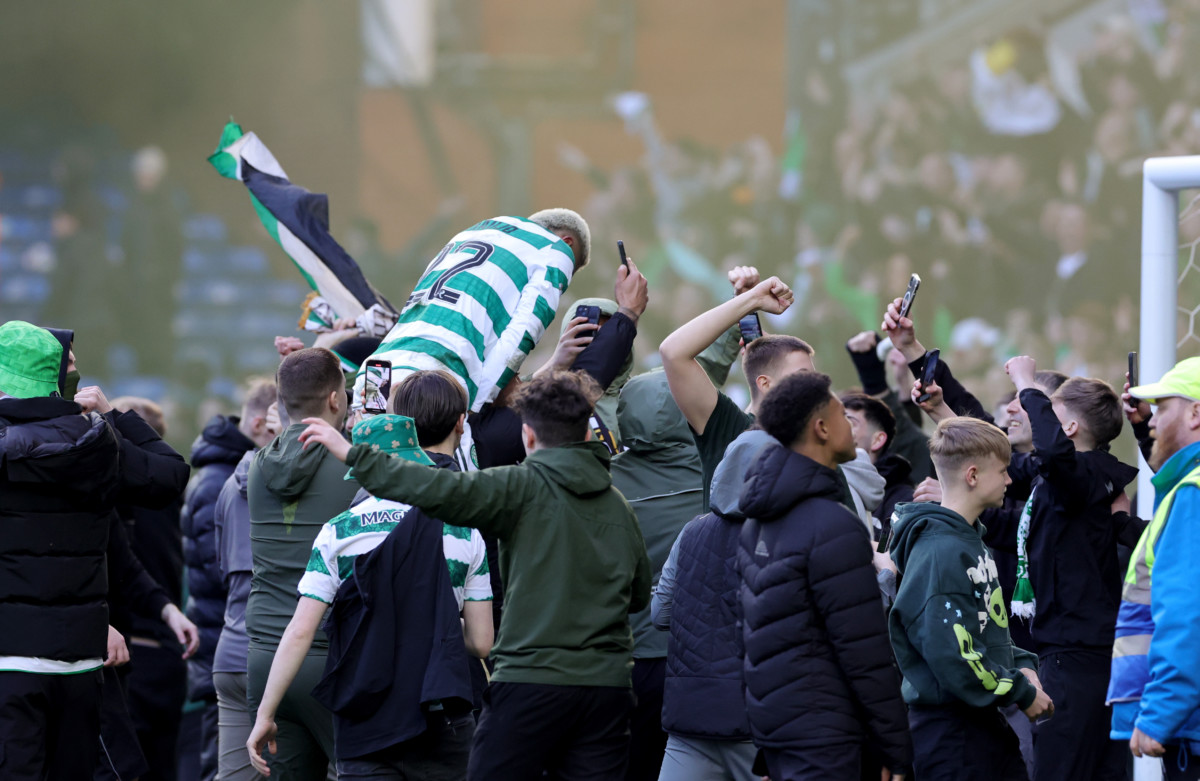 Celtic’s Julian Araujo is lifted up by fans