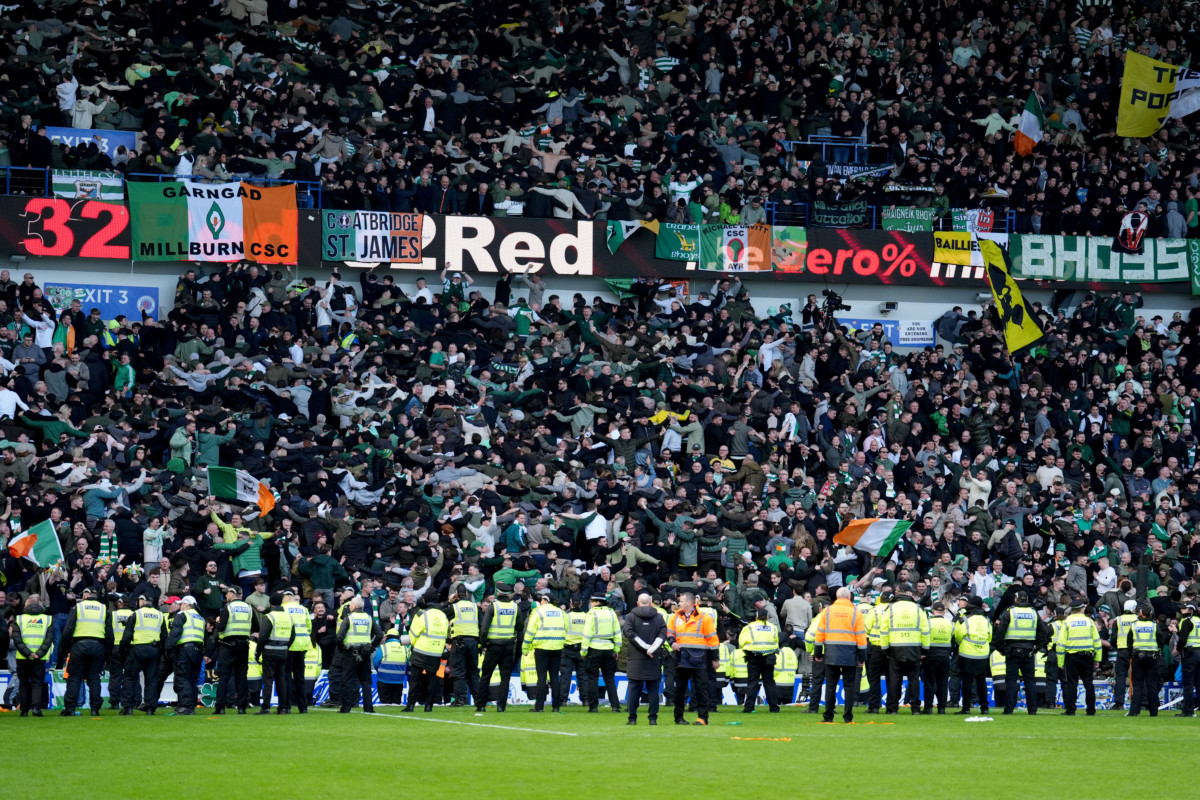 Celtic fans celebrate after police restored order (Andrew Milligan/PA)